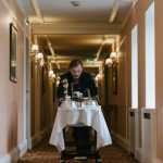 Concierge Services - Guest Service Staff pulling a Serving Tray