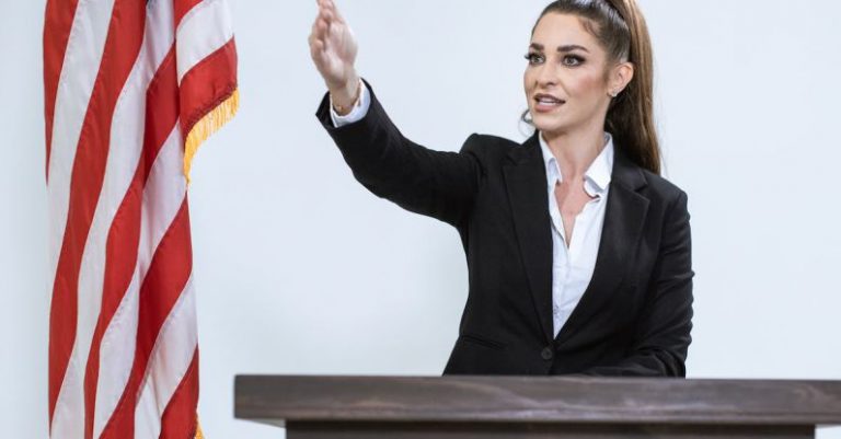 Event Hosting - Woman In Black Blazer Holding Us A Flag