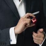 Exclusive - Man Holding Red Cube