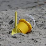 Seclusion - Yellow Plastic Bucket on Sand
