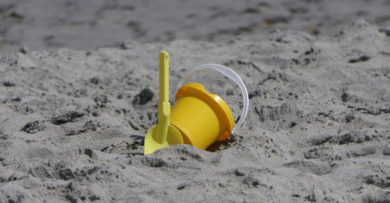 Seclusion - Yellow Plastic Bucket on Sand
