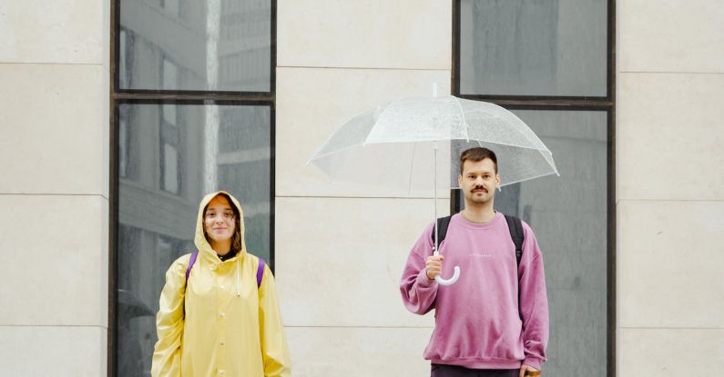 Owners - Dogs in Between the Man and Woman Standing