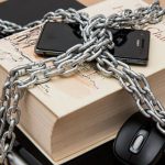 Privacy - Black Android Smartphone on Top of White Book