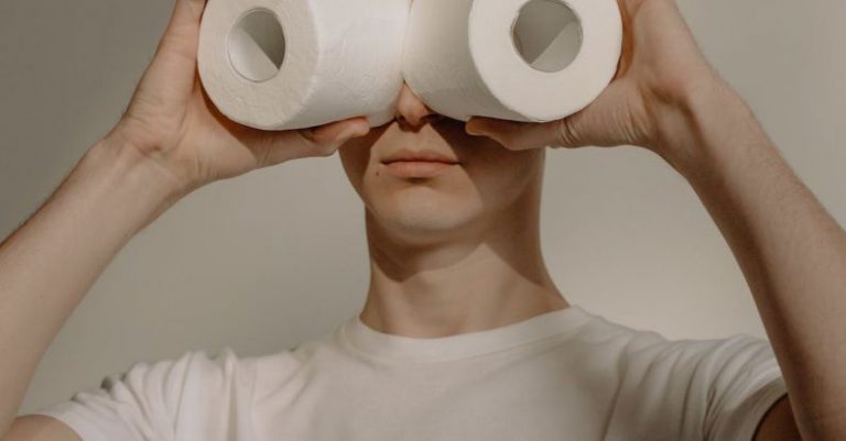 Safe Stay - Man in White Crew Neck Shirt Holding 2 White Tissue Rolls