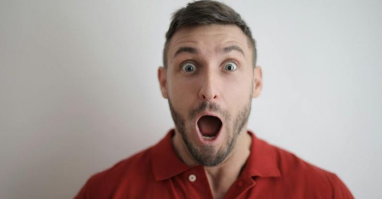 Surprise - Man in Red Button Up Shirt